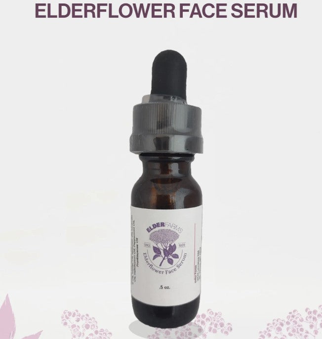 Elderflower face serum bottle with dropper on a light purple background