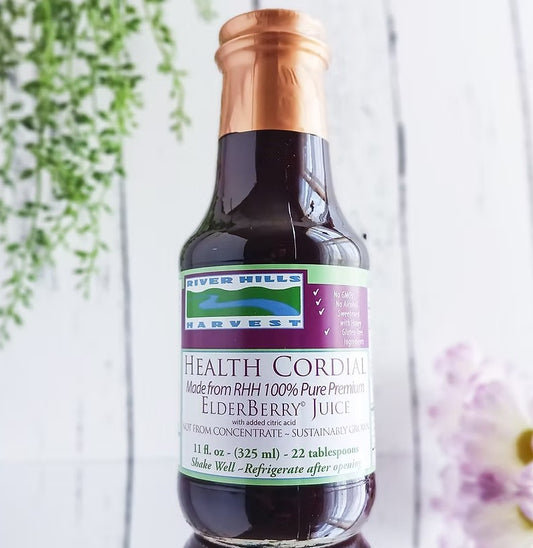 Bottle of River Hills Harvest Health Cordial with a purple label on a white background.