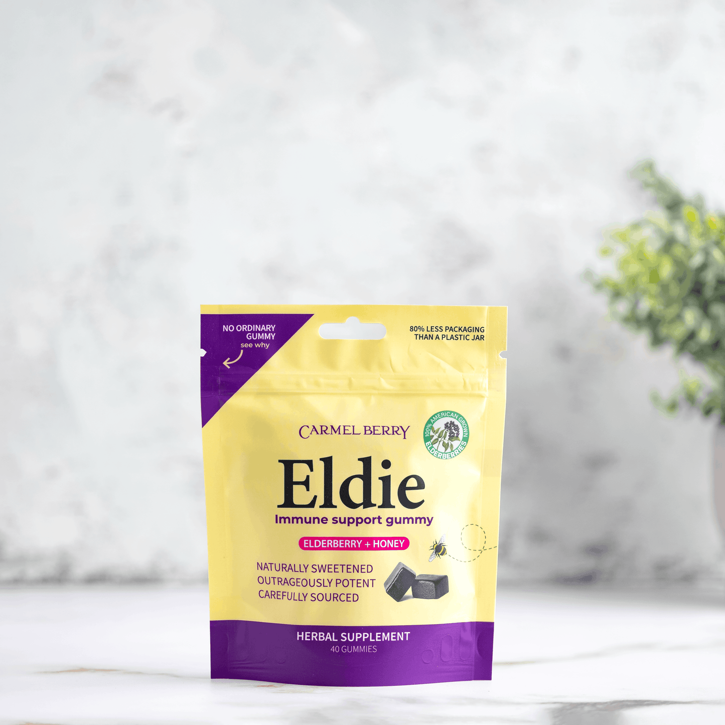 Eldie immune support gummy package on a white surface with a blurred background