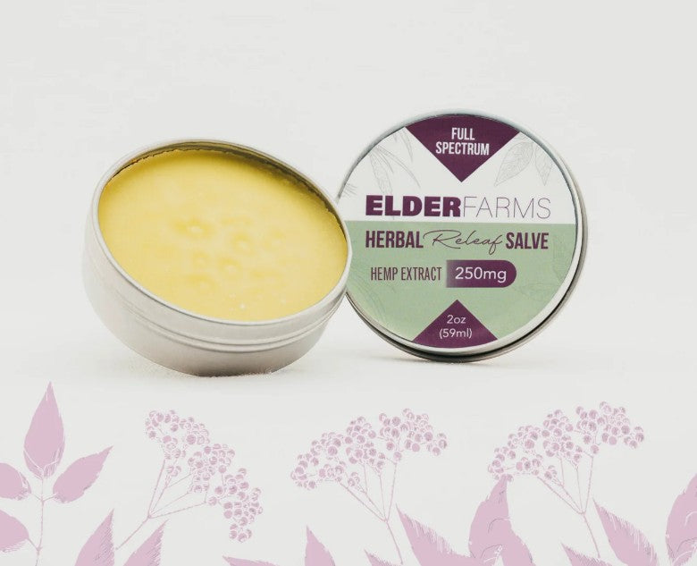 Elder Farms Herbal Relief Salve container with lid open on a white background