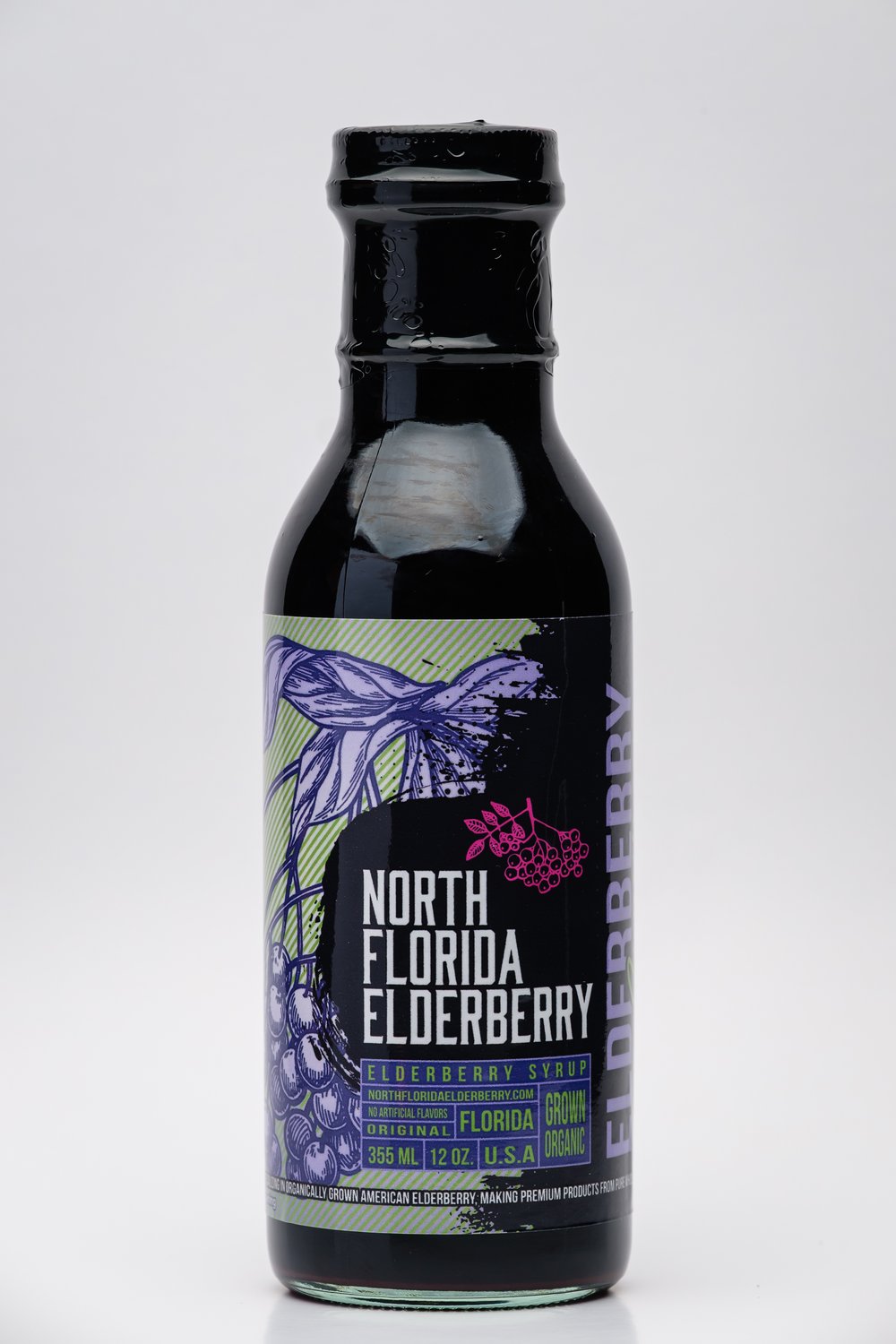 Bottle of North Florida Elderberry syrup with a label featuring elderberry graphics on a white background.