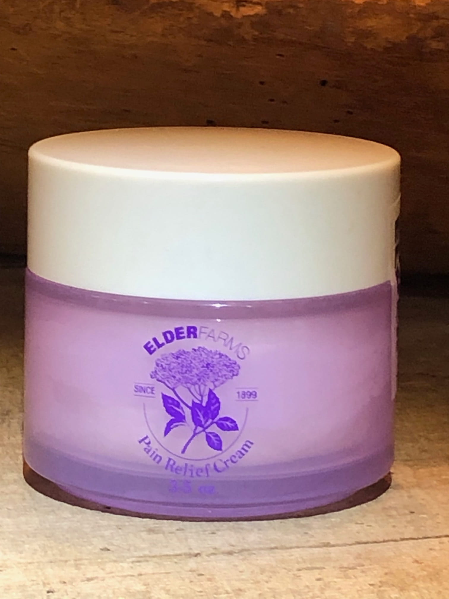 Pain_Releaf_Cream_Front_Bottle_On_Table2