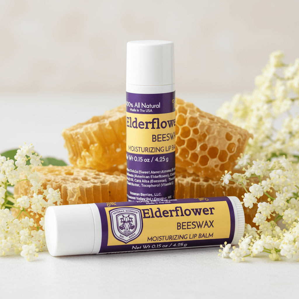 Two Elderflower Beeswax lip balms with honeycomb and flowers on a light background